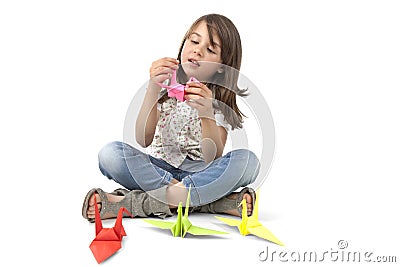 Child with origami bird Stock Photo