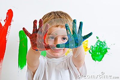 Child painting with messy hands Stock Photo