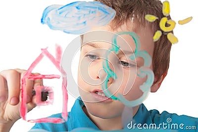 Child paints on glass Stock Photo