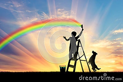 Child paints the seascape with a rainbow Stock Photo