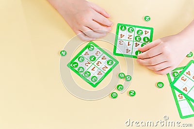 Child pays sudoku board game Stock Photo