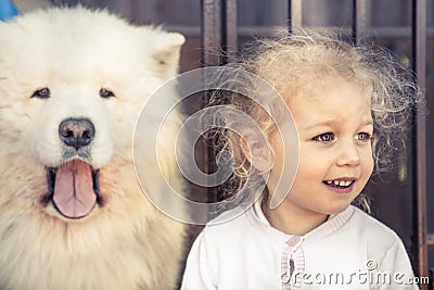 Child pet dog portrait domestic animal and similar child owner concept domestic animal guard friendship Stock Photo