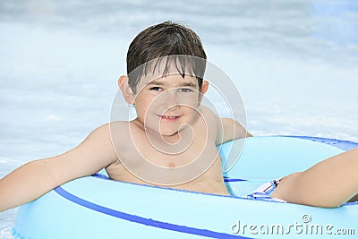 Child play at the pool place in a beautifull Stock Photo