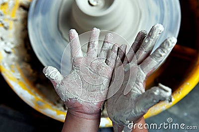 Child play with pottery Stock Photo