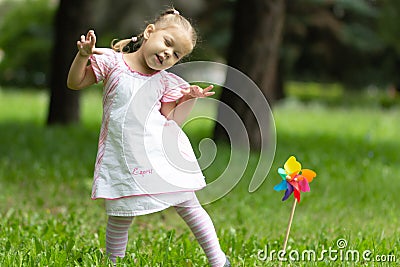 Child playing the ape in the summer park Stock Photo