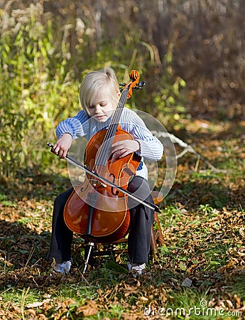 Child Playing Cello Stock Photo