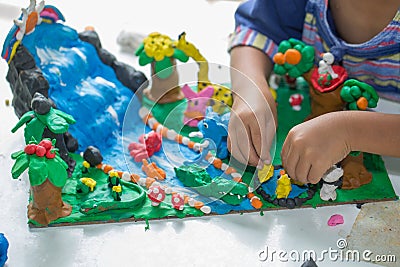 Child playing with clay molding shapes,Children creativity. Stock Photo