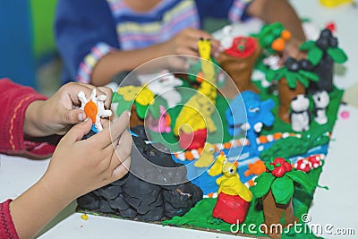 Child playing with clay molding shapes,Children creativity. Stock Photo