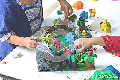 Child playing with clay molding shapes,Children creativity. Stock Photo