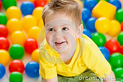 Child playing colorful balls top view Stock Photo