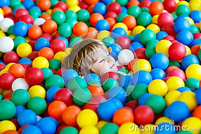 Child playing at colorful plastic balls playground Stock Photo