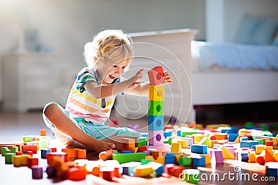 Child playing with colorful toy blocks. Kids play Stock Photo