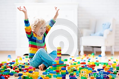 Child playing with toy blocks. Toys for kids. Stock Photo