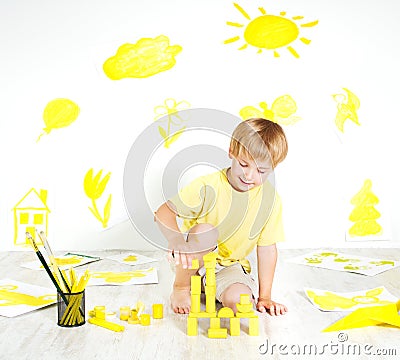 Child playing with construction blocks. Creativity Stock Photo