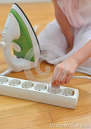 Child playing with electricity. Stock Photo