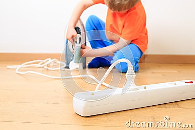 Child playing with electricity, kids safety Stock Photo