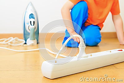 Child playing with electricity, kids safety Stock Photo