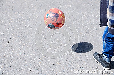 Child playing football on asphalt, ball jump,soccer team player, training outdoor, active lifestyle Stock Photo