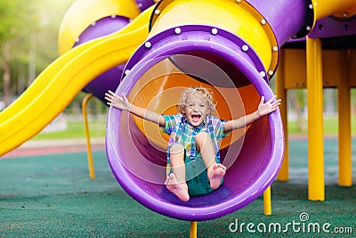 Child on playground. Kids play outdoor Stock Photo