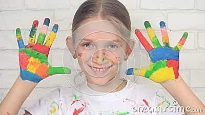 Child Playing Painted Hands Looking in Camera, Smiling School Girl Face, Kids Stock Photo