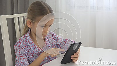 Child Playing Tablet, Kid uses Smartphone Interior View, Little Girl Texting Pad Stock Photo