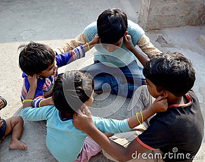 Child playing on their house roof. Editorial Stock Photo