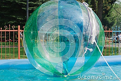 Child playing in a water ball Editorial Stock Photo