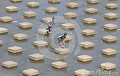 A child playing water in the Dam water Colo Nguter Sukoharjo Ce Editorial Stock Photo