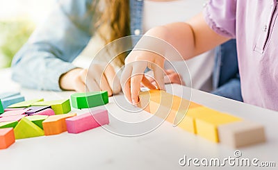 Child playing with wood blocks Stock Photo