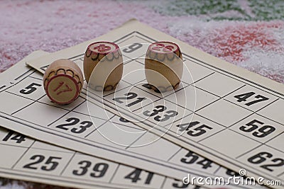 The child plays lotto. hold the barrels in your hands. board game during the weekend and insulation at home Stock Photo
