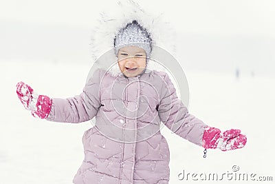 Child plays with snow. winter activities Stock Photo