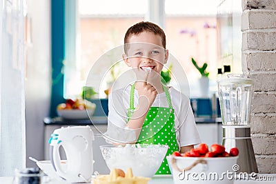 Child preparing sweet dessert and snacking Stock Photo