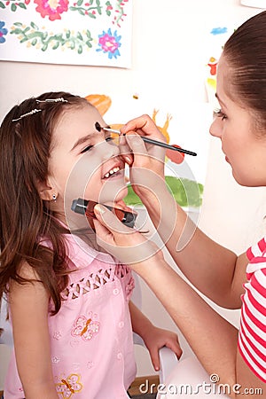 Child preschooler with face painting. Stock Photo