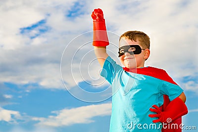 Child pretending to be a superhero Stock Photo