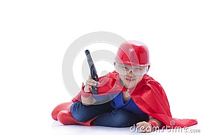 Child pretending to be a superhero with toy gun Stock Photo