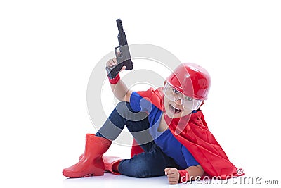 Child pretending to be a superhero with toy gun Stock Photo