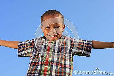 Child Pretending to Fly Stock Photo