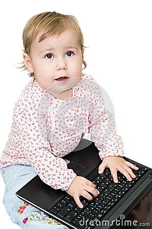Child printing on laptop Stock Photo