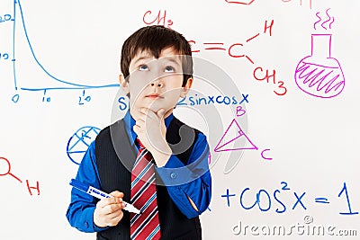 Child prodigy in meditations at chalkboard Stock Photo