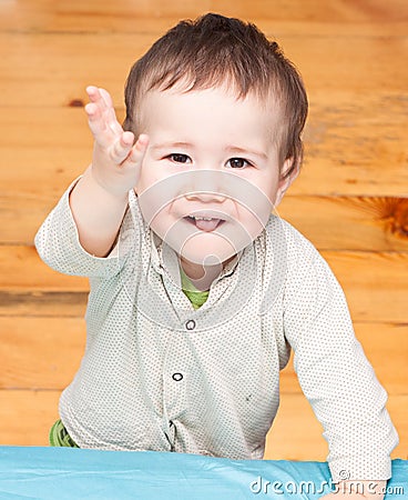 Child pulls his hand up Stock Photo