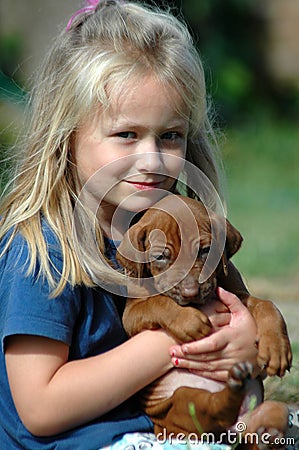 Child with puppy pet Stock Photo