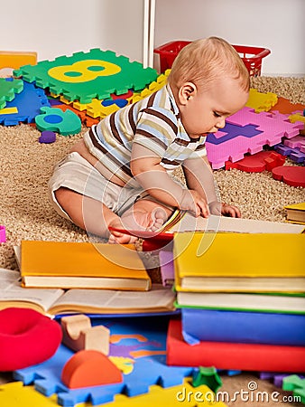 Child puzzle making by baby. Kid jigsaw develops children. Stock Photo