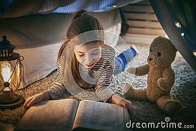 Child is reading a book Stock Photo