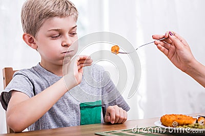 Child refusing to eat dinner Stock Photo