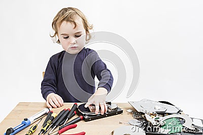 Child repairing computer part Stock Photo