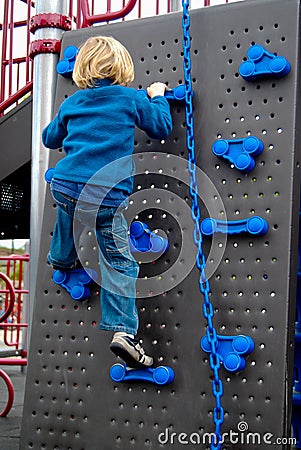 Child Climbing Wall Stock Photo