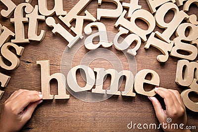 Child`s Hand Arrange Home Word Stock Photo