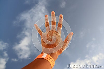 Hand covered in sand Stock Photo