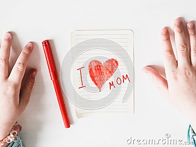 Child's hands and a beautiful drawing. Top view Stock Photo