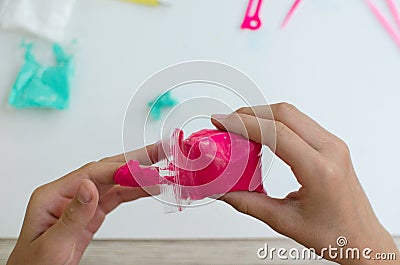 Child`s hands with colored plasticine. Stock Photo